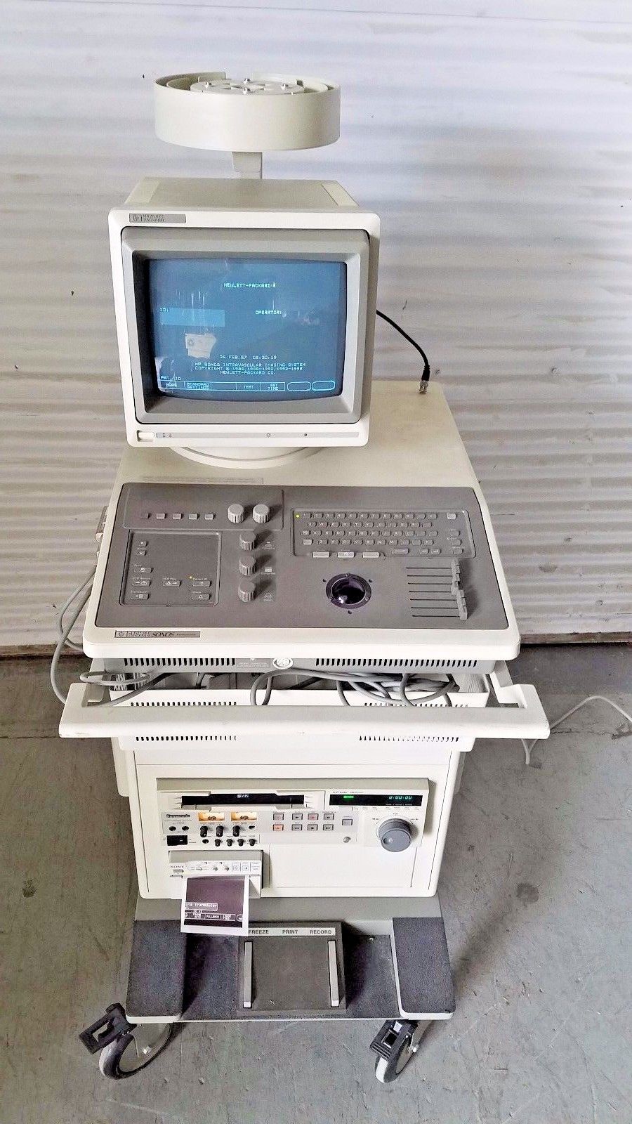 a computer sitting on top of a cart
