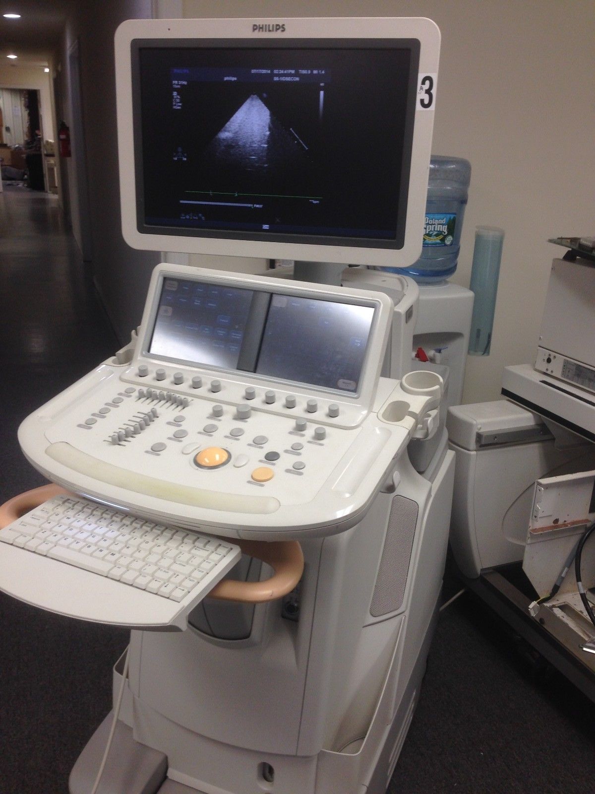 a medical machine with a monitor on top of it