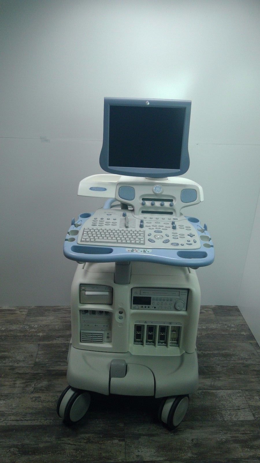 a computer sitting on top of a cart